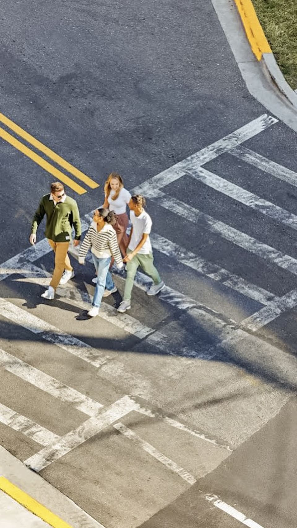 student walking across a street